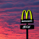McDonald's sign surrounded by dramatic sunset